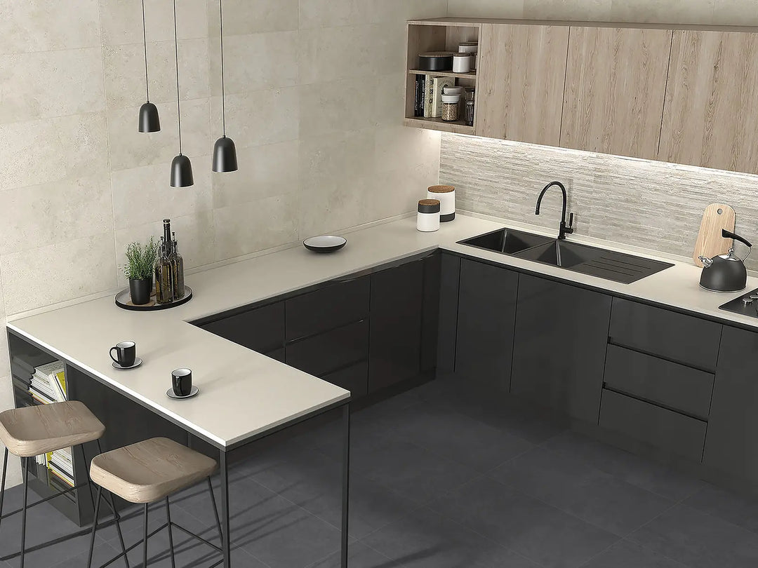 Modern kitchen with gray cabinets, white countertops, and wooden accents.