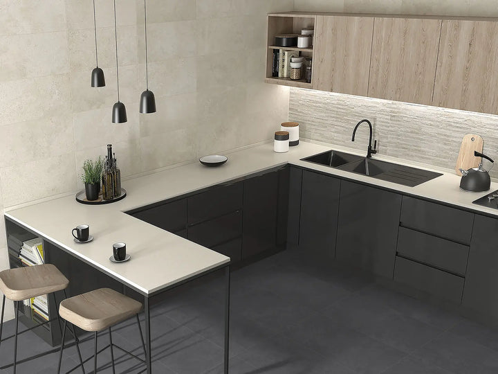 Modern kitchen with gray cabinets, white countertops, and wooden accents.