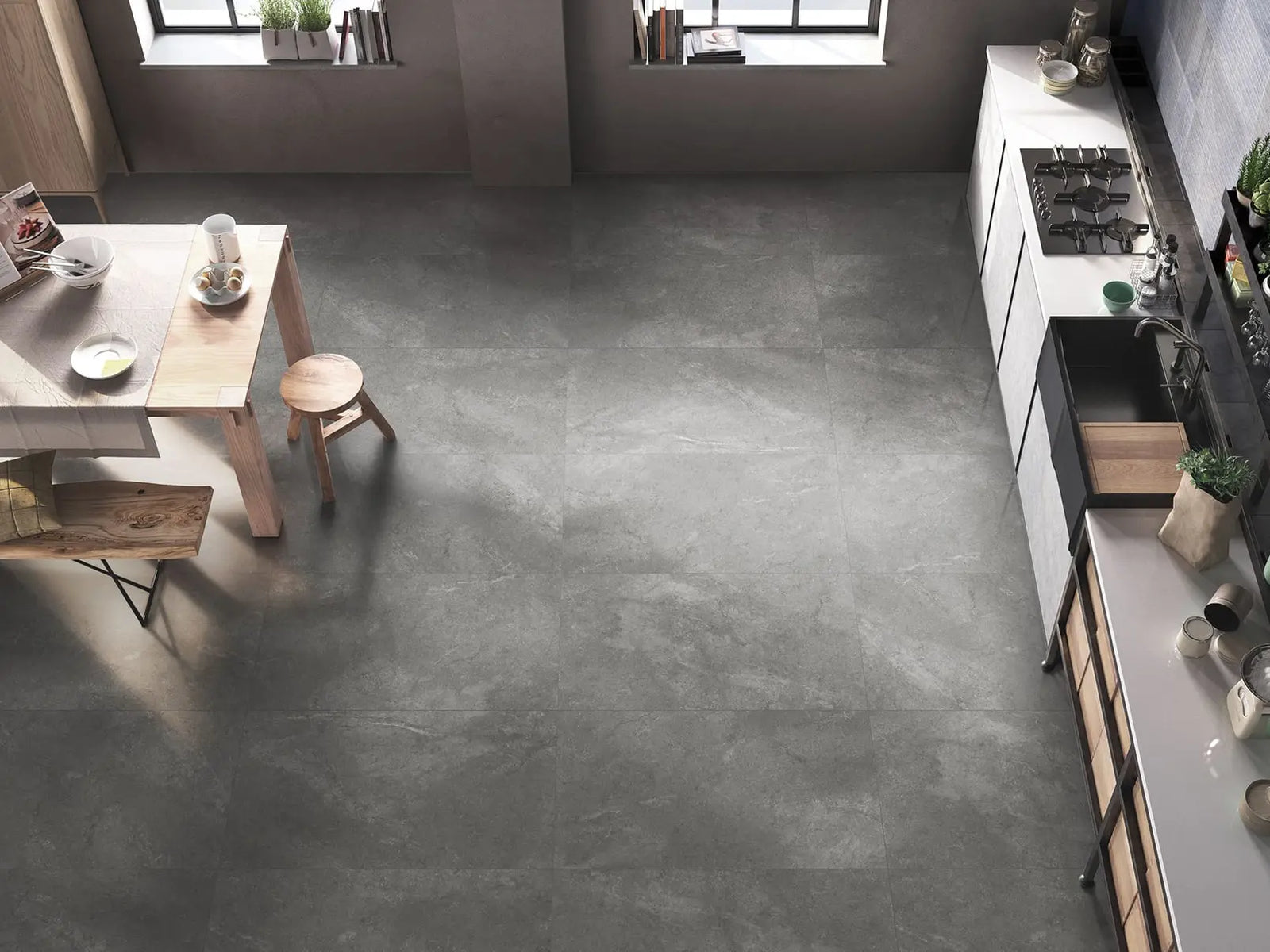 Modern kitchen with dark gray concrete floor