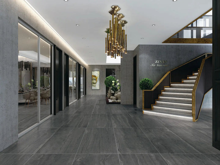 Luxurious interior of a building with a staircase, chandelier, and Zara Home sign.
