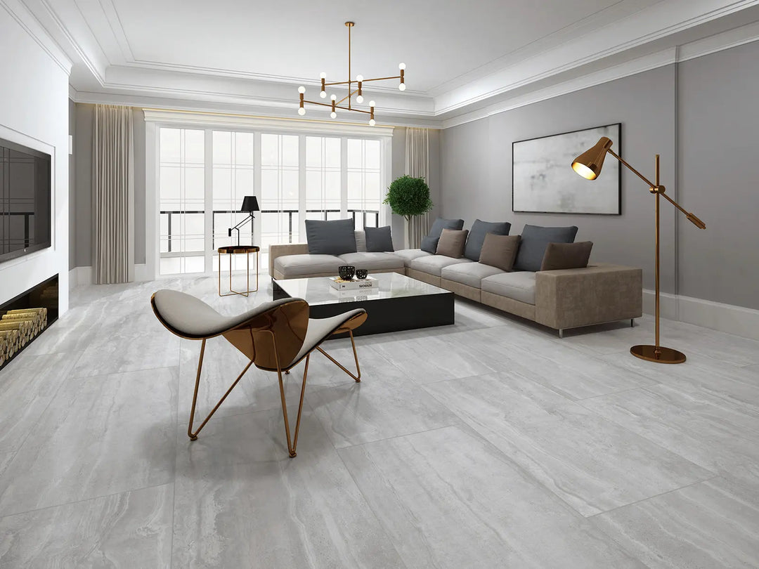 Modern living room with a sectional sofa, coffee table, and decorative items.