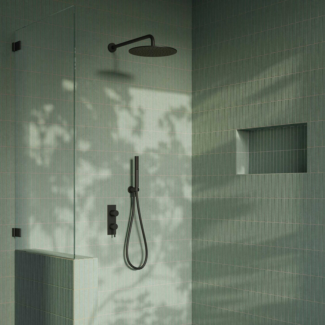 Modern shower setup with black fixtures on a tiled wall
