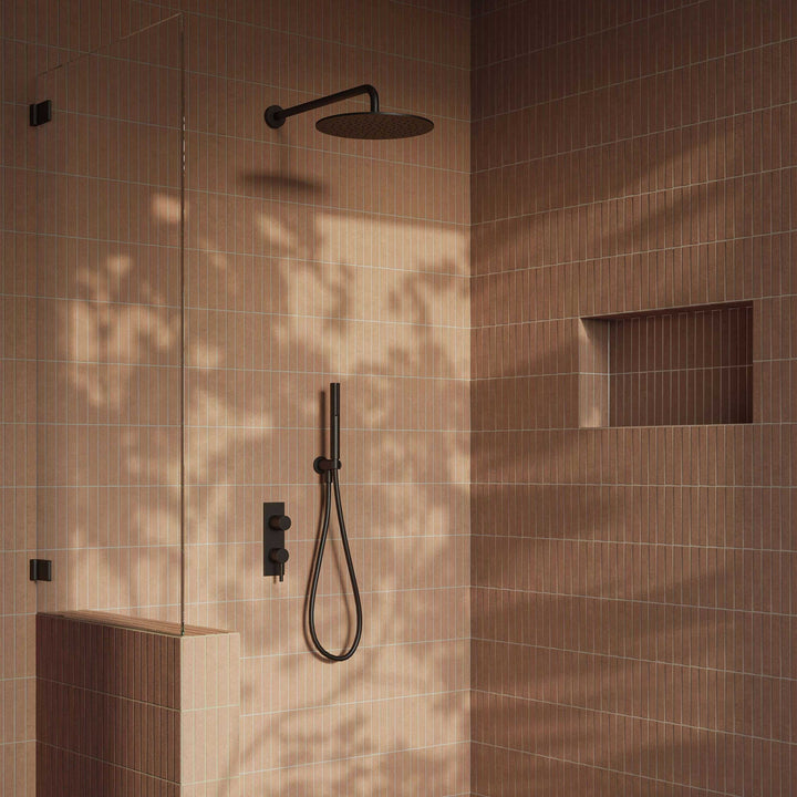 Modern shower setup with black fixtures in a tiled bathroom