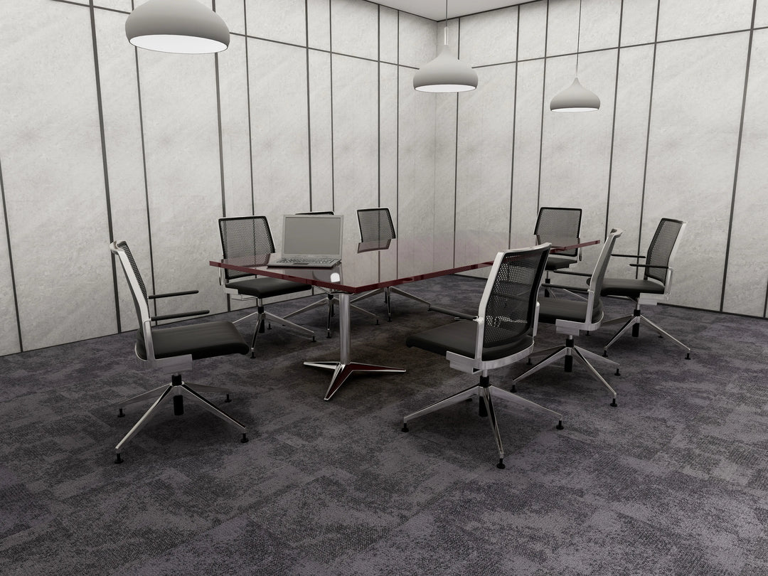 Modern conference room with a glass table and office chairs.