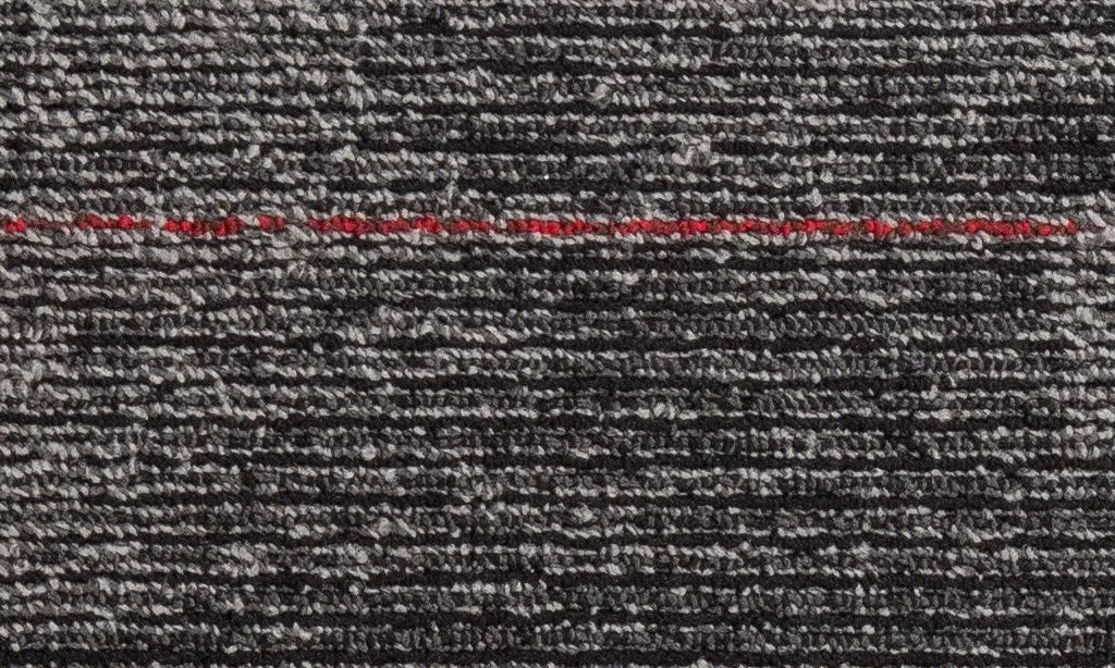 Close-up of textured gray fabric with red text overlay