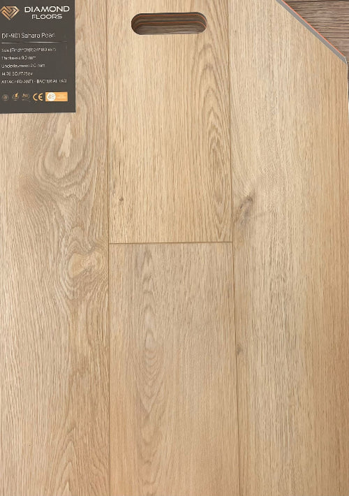 Close-up of a wooden flooring sample with a Diamond Floors label.
