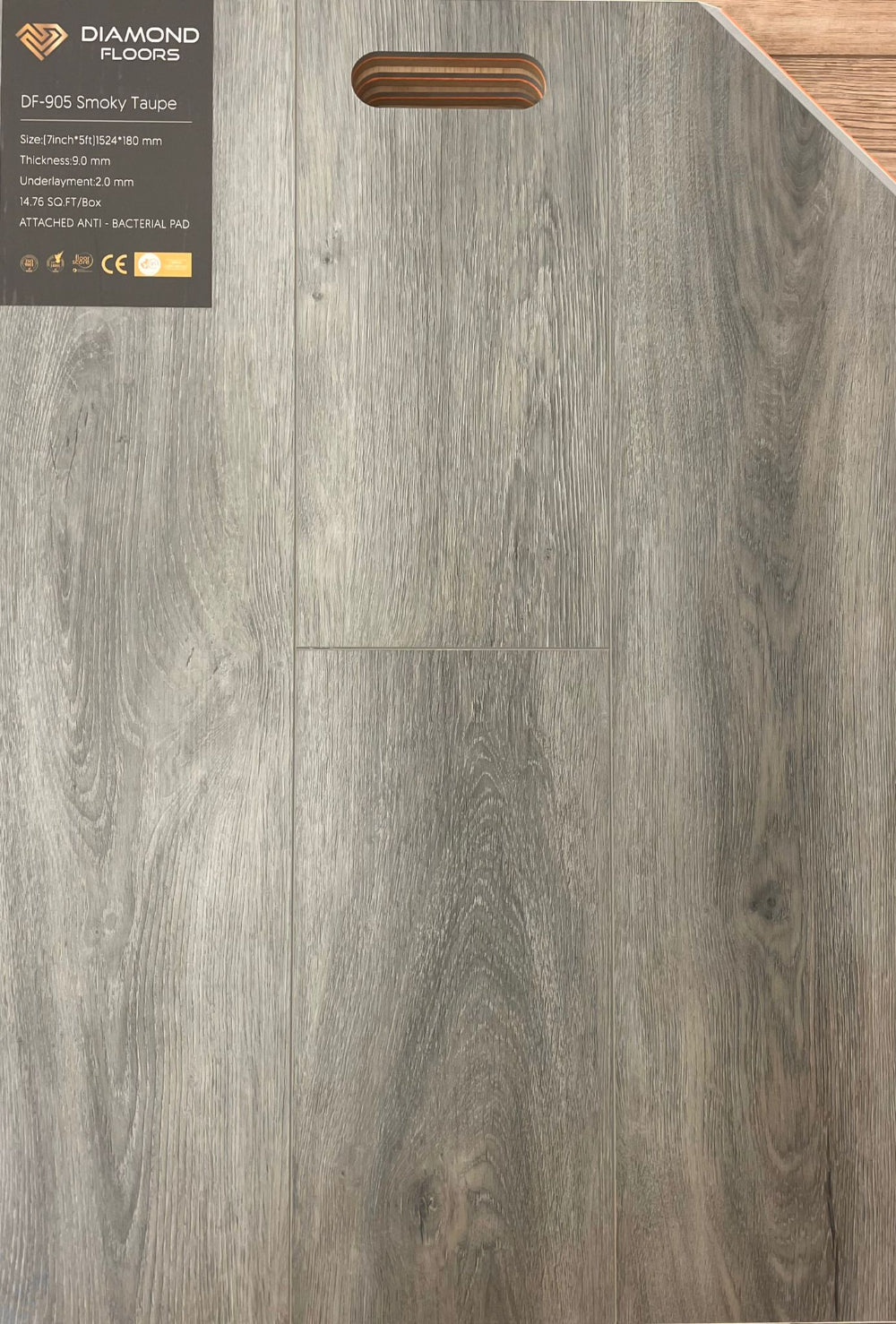 Diamond Floors vinyl flooring with a wood grain pattern and product label.