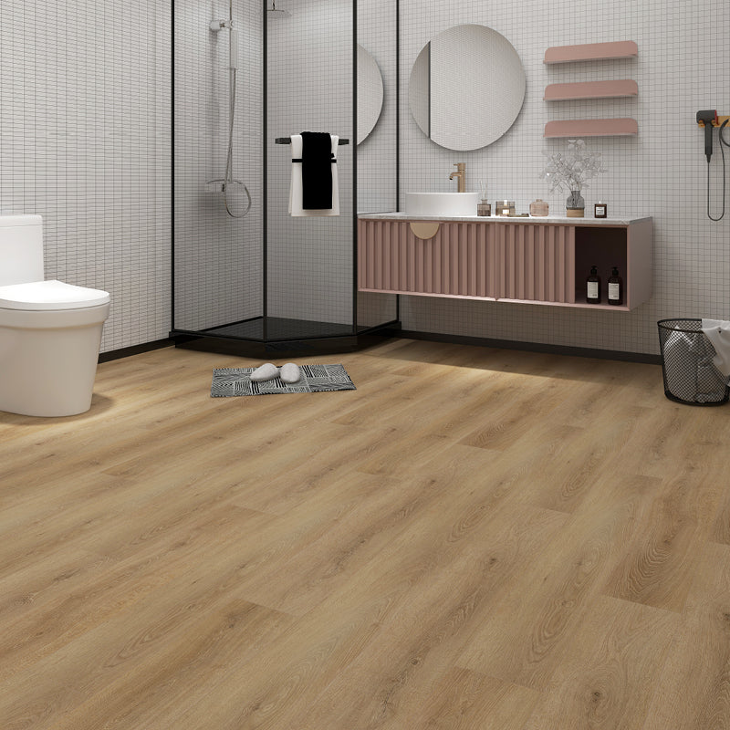 Bathroom with wooden flooring, shower, sink, and vanity.