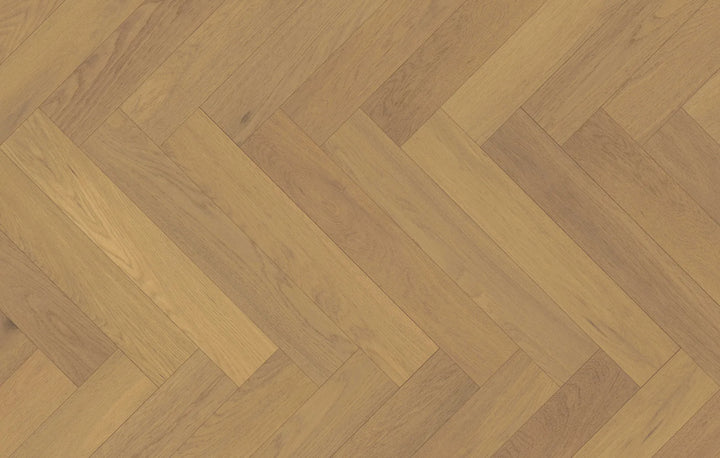Close-up of Dusken Veil engineered hardwood from Fuzion's Velvet Grove Herringbone collection. Available at Advanced Flooring Waterloo.