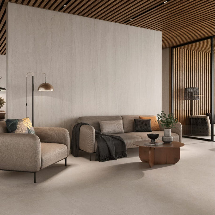 Modern living room with gray sofa, armchair, and wooden coffee table.