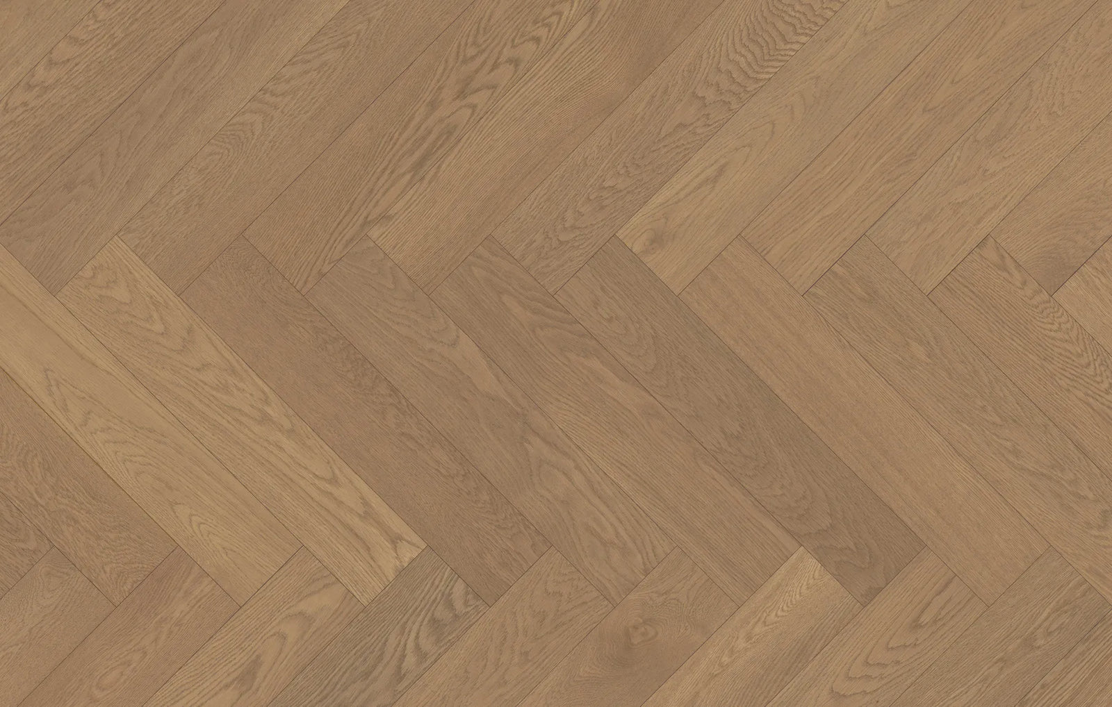 Close-up of Ember Cloak engineered hardwood from Fuzion's Velvet Grove Herringbone collection. Available at Advanced Flooring Waterloo.