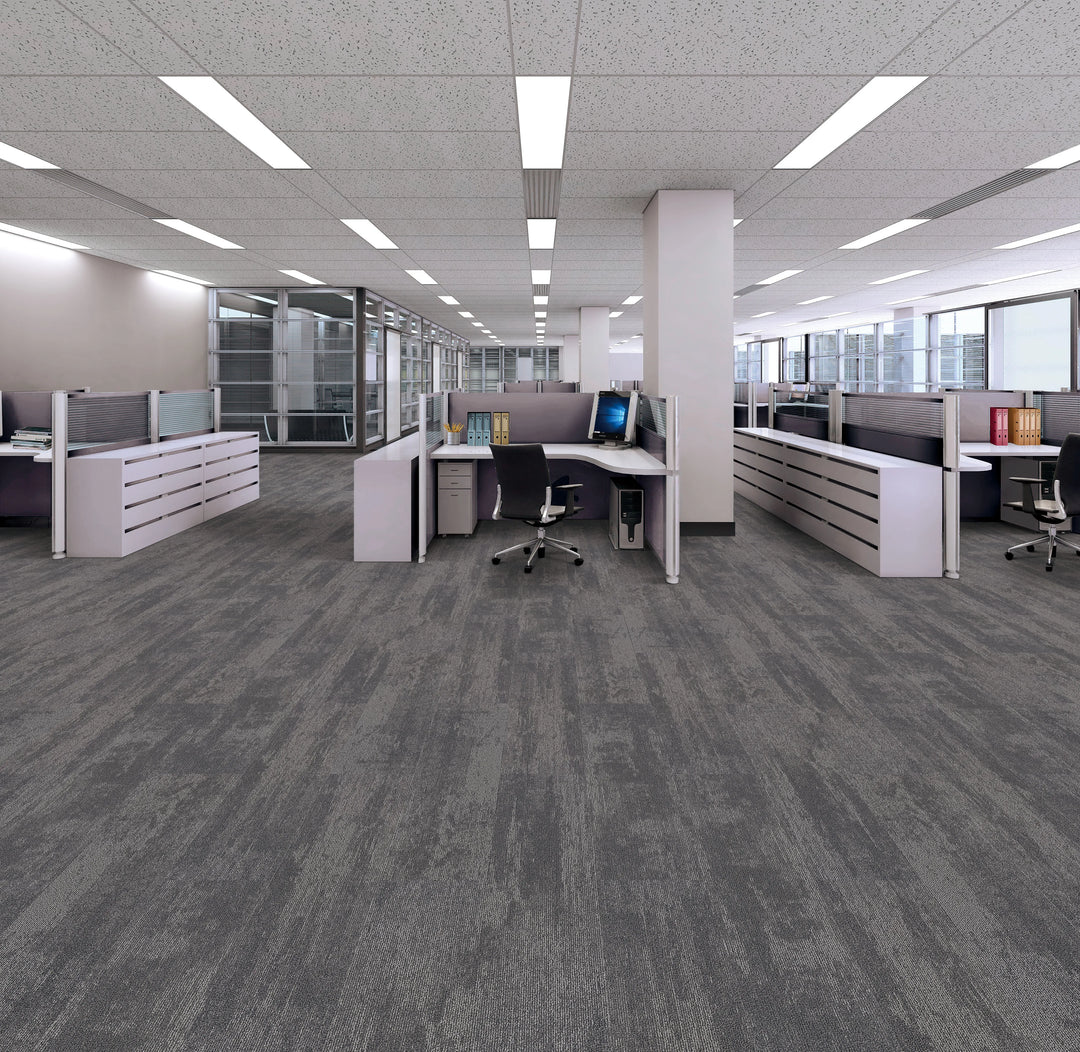 Modern office space with gray carpet and office furniture.