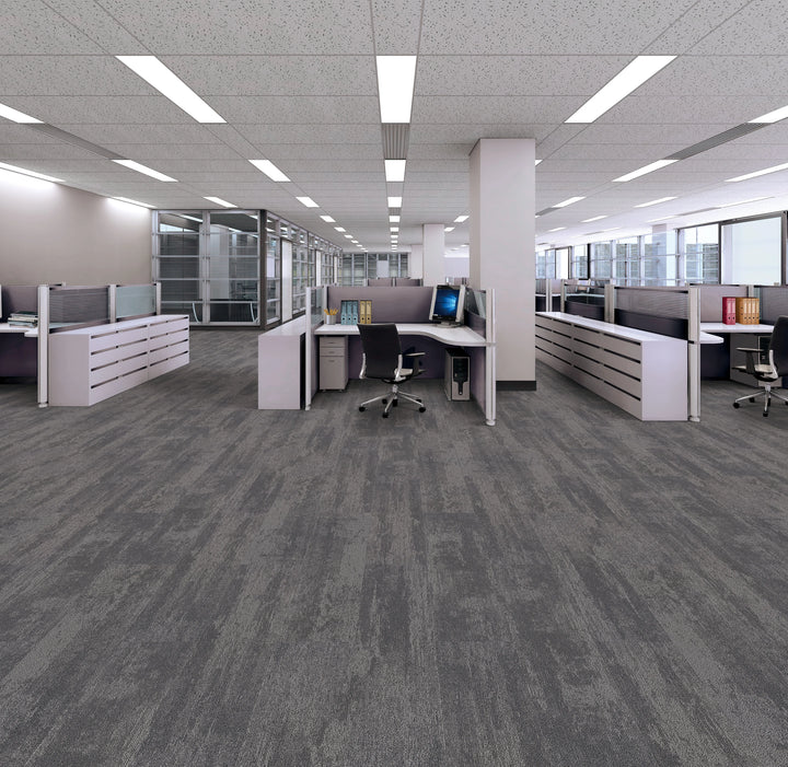 Modern office space with gray carpet and office furniture.