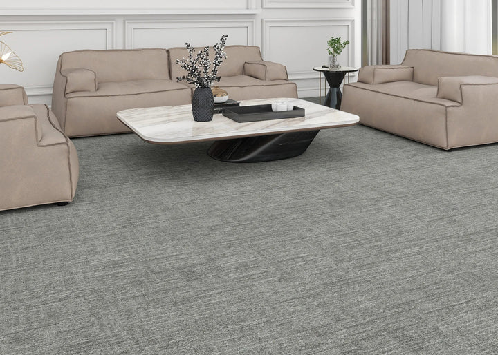 Beige sofa set with a coffee table in a modern living room.