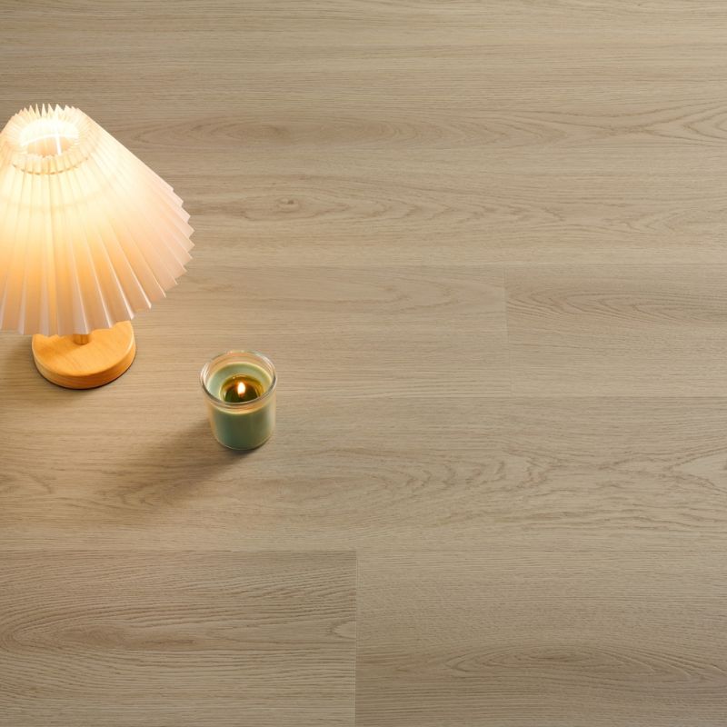 Close-up view of Grandeur Inov8 SPC vinyl flooring in Mermaid’s Cove color, featuring elegant beige tones and natural wood grain texture.