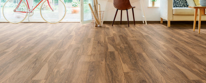 Wooden flooring in a room with furniture and decor