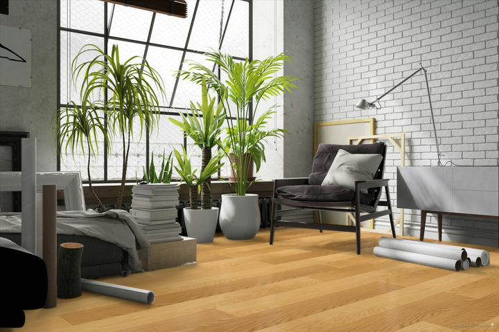 Modern living room with plants, furniture, and a white brick wall.