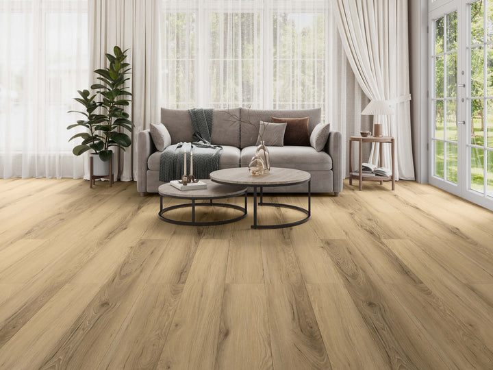 LV326 Alta medium-to-dark rustic oak laminate flooring shown in a bright, modern living room setting. Available at Advanced Flooring Waterloo. 