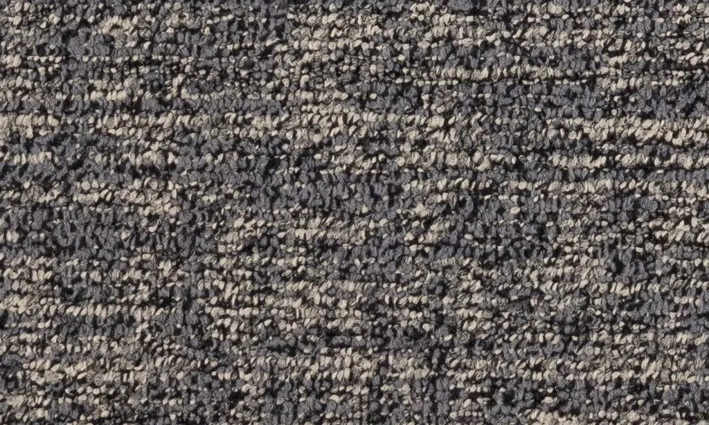 Close-up of textured black and beige carpet