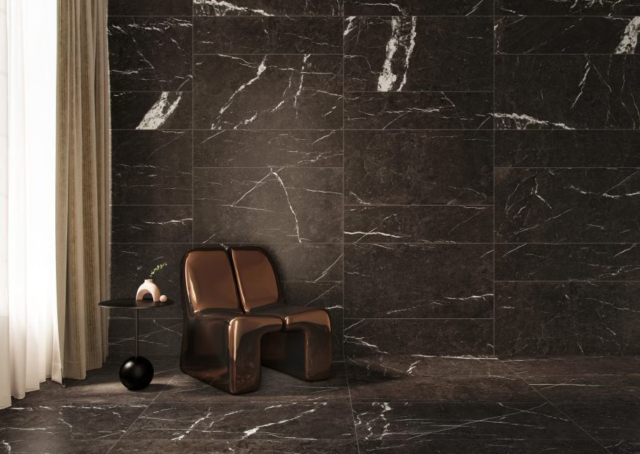 Modern chair against a dark marble wall