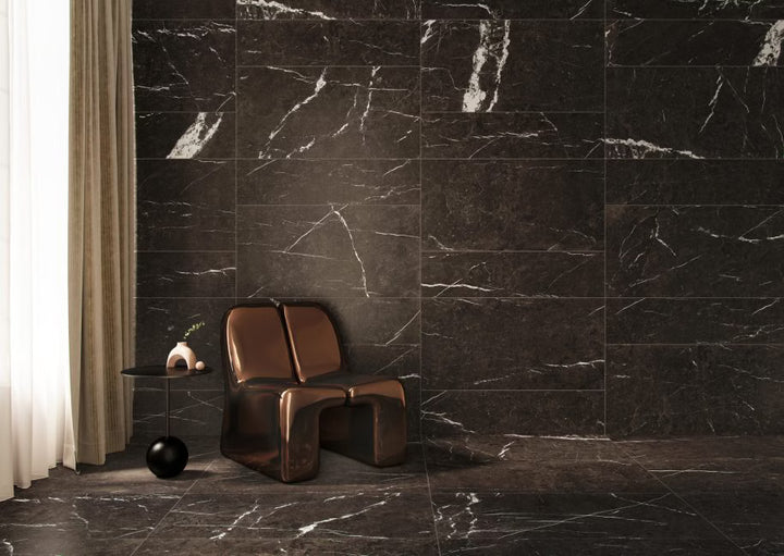 Modern chair against a dark marble wall