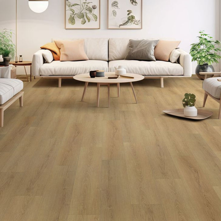 Living room with wooden flooring, white sofa, and decorative elements.