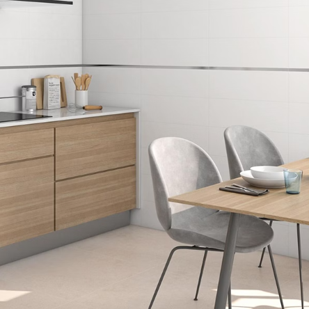 Porcelain tiles installed on a wall in a kitchen setting, blending with the modern decor.