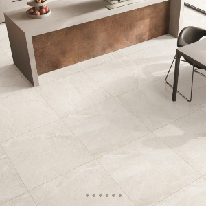 Porcelain tiles with a matte finish, installed on the floor of a modern kitchen setting, displaying a neutral color palette.