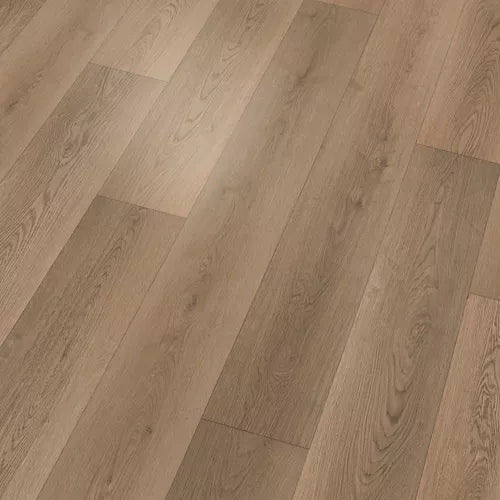 Light oak wood flooring planks arranged in a herringbone pattern, showing natural wood grain and subtle variations in tone.