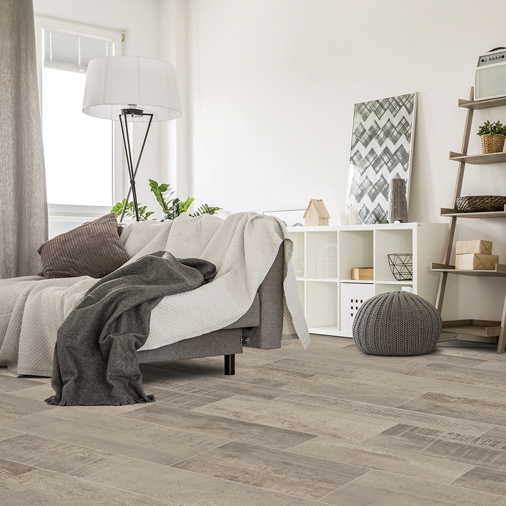 Modern bedroom with wooden flooring, bed, and shelves.