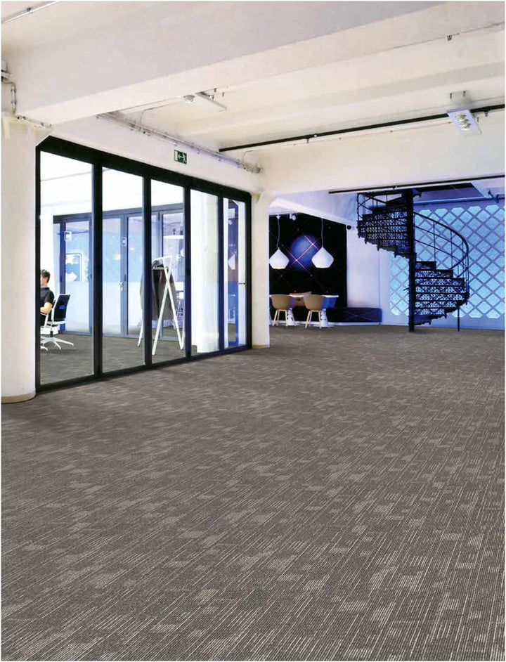 Modern office interior with gray carpeted floor and glass walls.