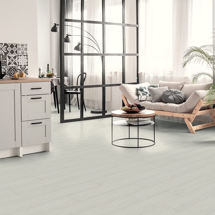 Modern living room with white tiled floor, wooden furniture, and a glass partition.