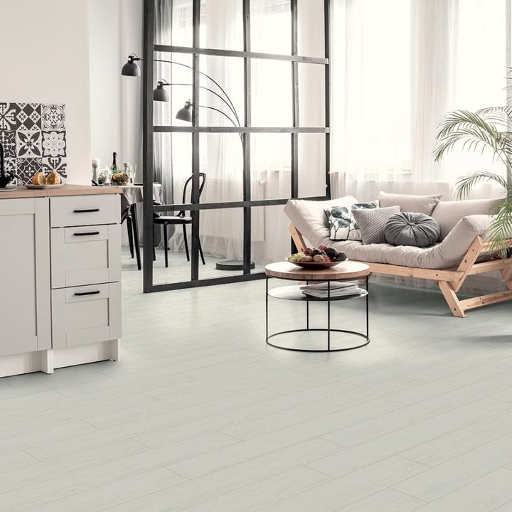 Modern living room with white tiled floor, wooden furniture, and a glass partition.