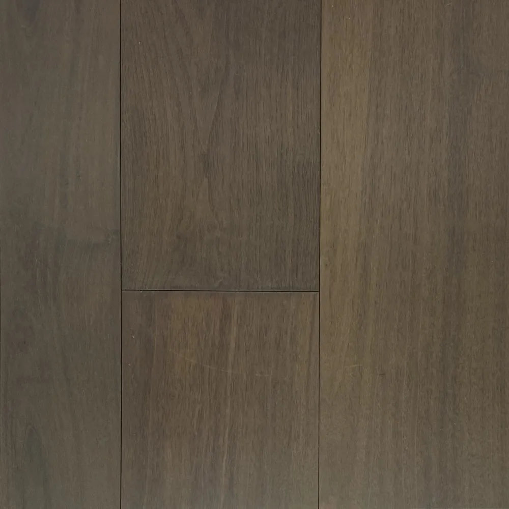 Close-up of dark brown wooden flooring with a visible grain pattern.
