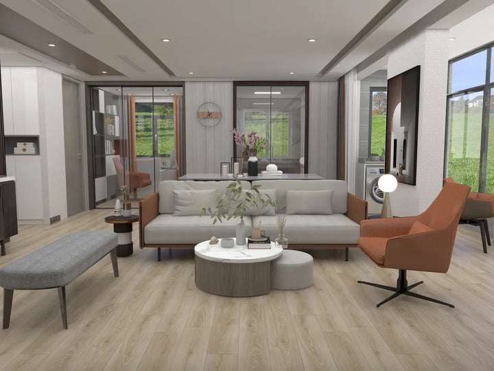 Modern living room with gray sofa, orange chair, and round coffee table.