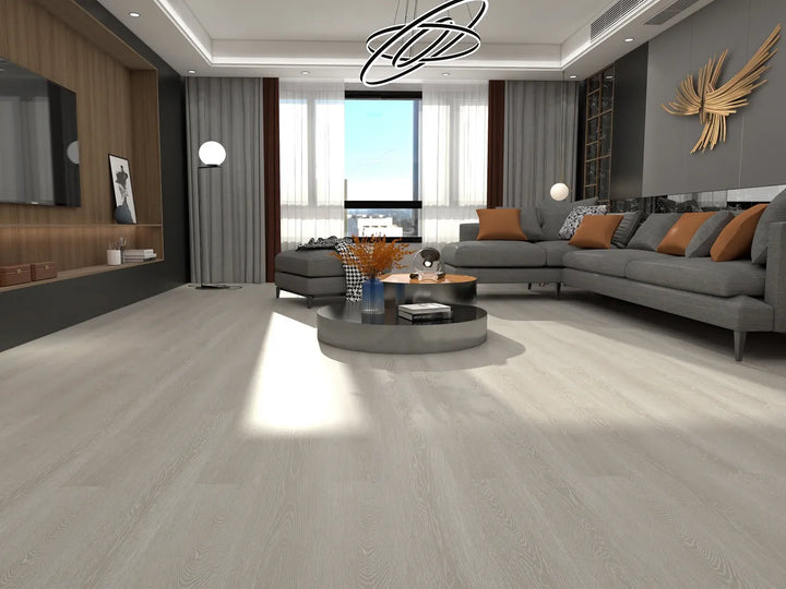 Modern living room with a gray sectional sofa, coffee table, and decorative elements.