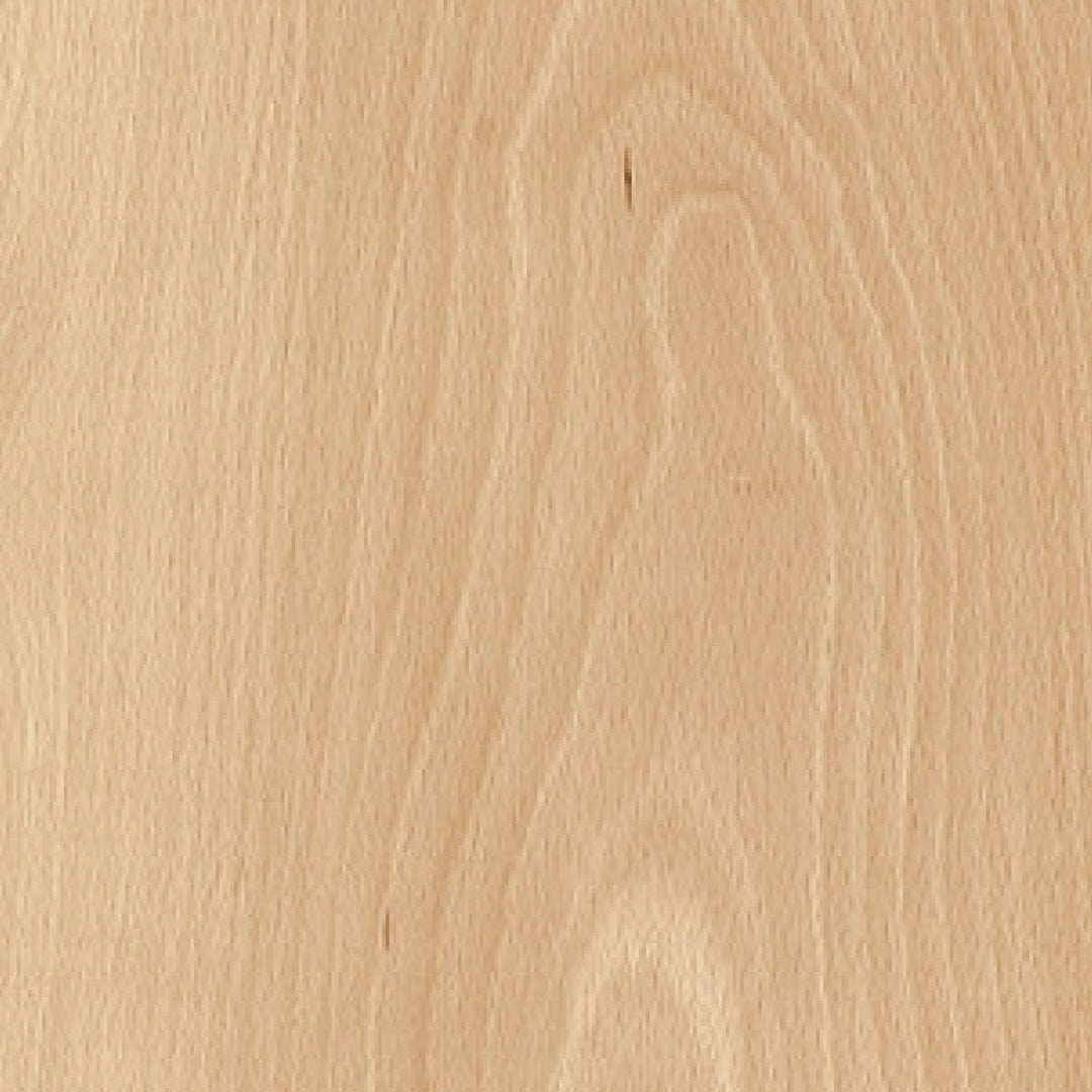 Close-up of a wooden surface with a light brown color and visible grain pattern.