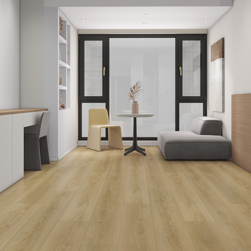 Modern interior design with a gray sofa, beige chair, and wooden floor.