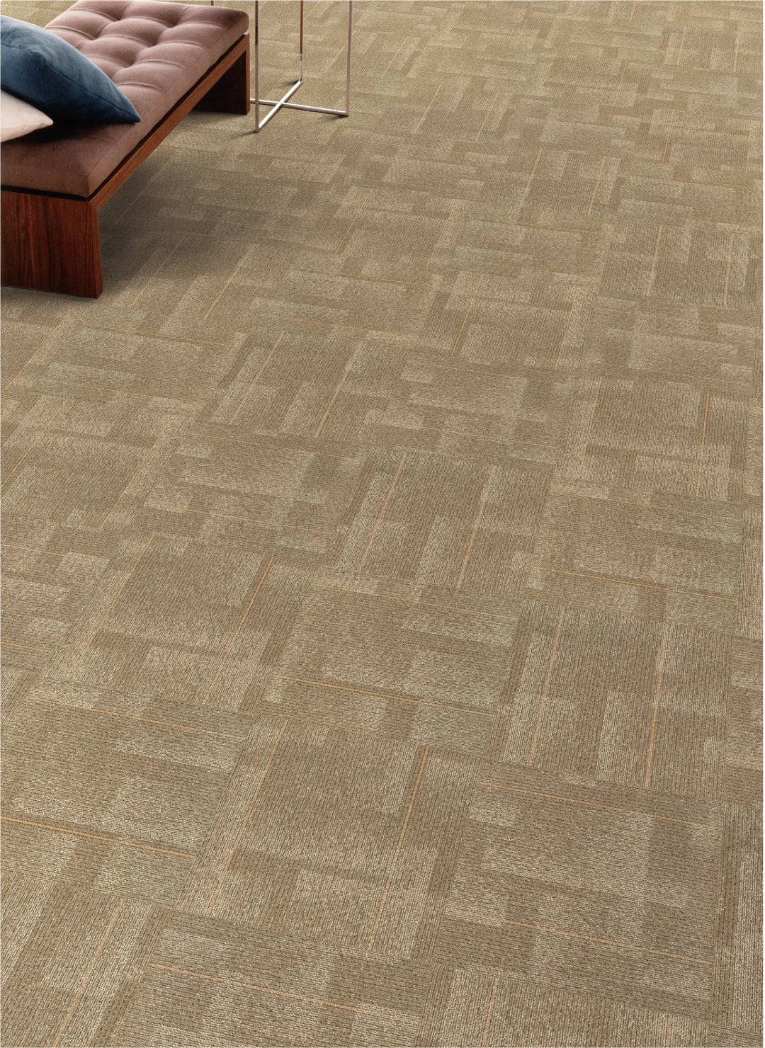 Patterned carpet with a herringbone design in a room setting.