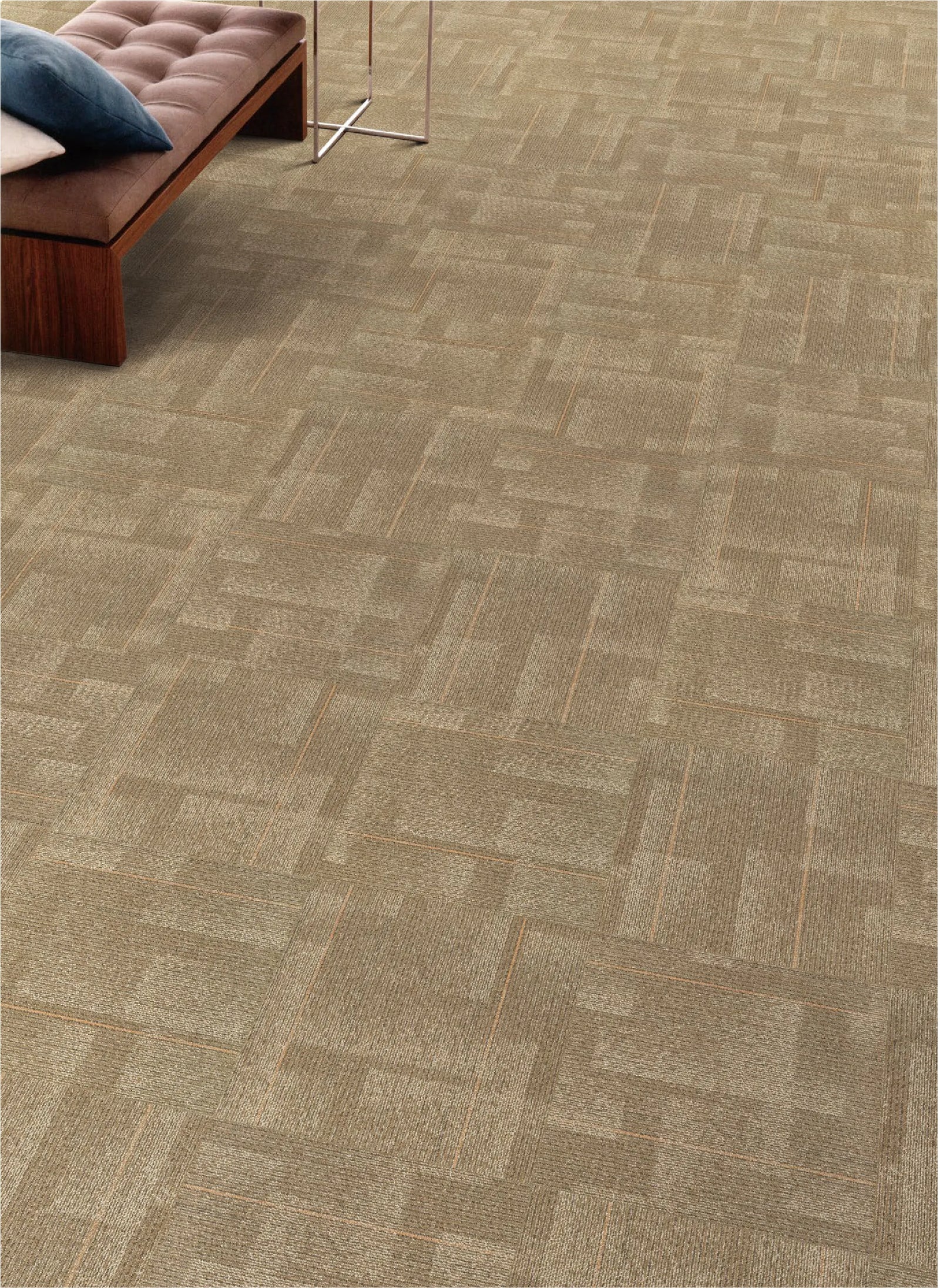 Patterned carpet with a herringbone design in a room setting.