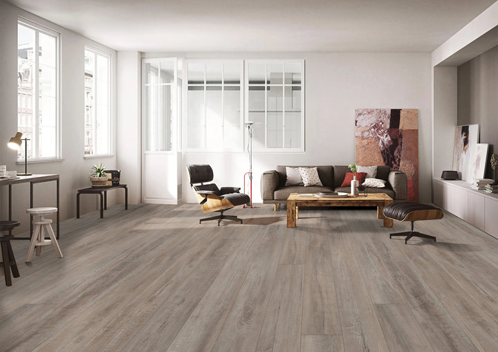 Modern living room with wooden flooring, furniture, and decor.