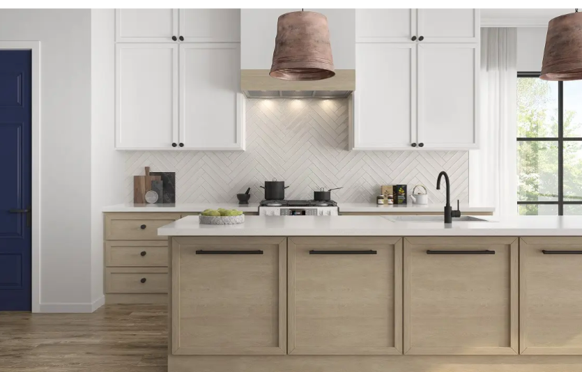 Modern kitchen with white cabinets, marble countertop, and stainless steel appliances.