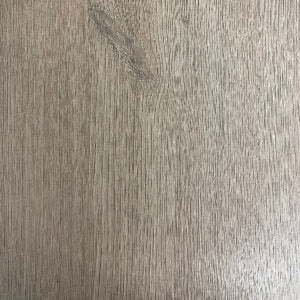 Close-up image of Seefeld Sand 12mm laminate flooring from the Authentic Titan Collection, showcasing the wood grain texture.