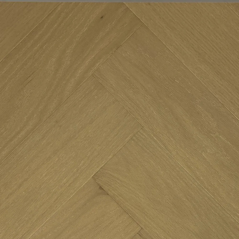 Close-up of wooden flooring with a herringbone pattern