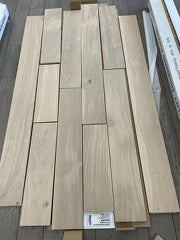 Planks of Snowwhite VIDAR premium American Oak engineered hardwood flooring.