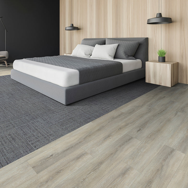 Modern bedroom with a gray bed, nightstands, and lamps.