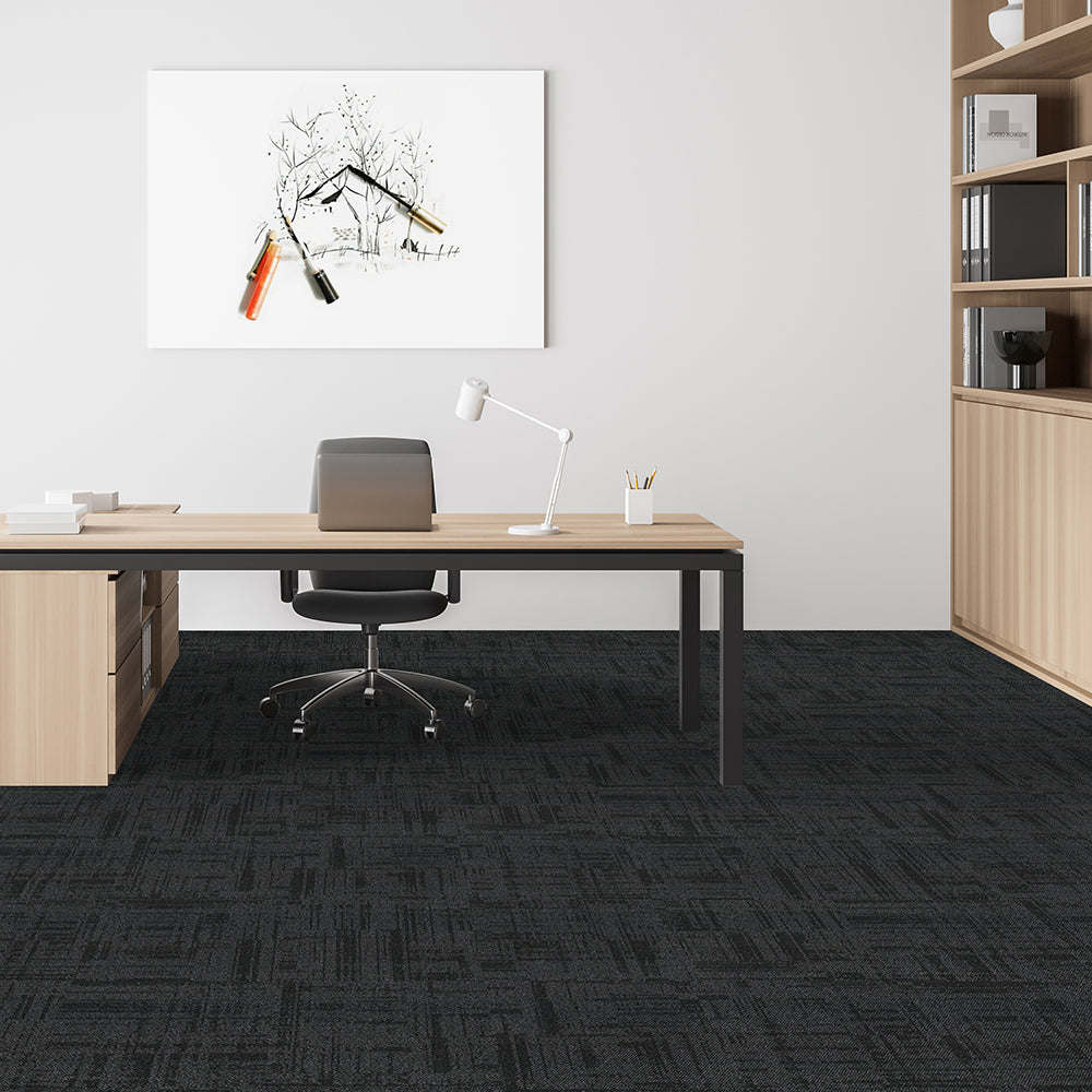 Modern office space with a desk, chair, and bookshelf.