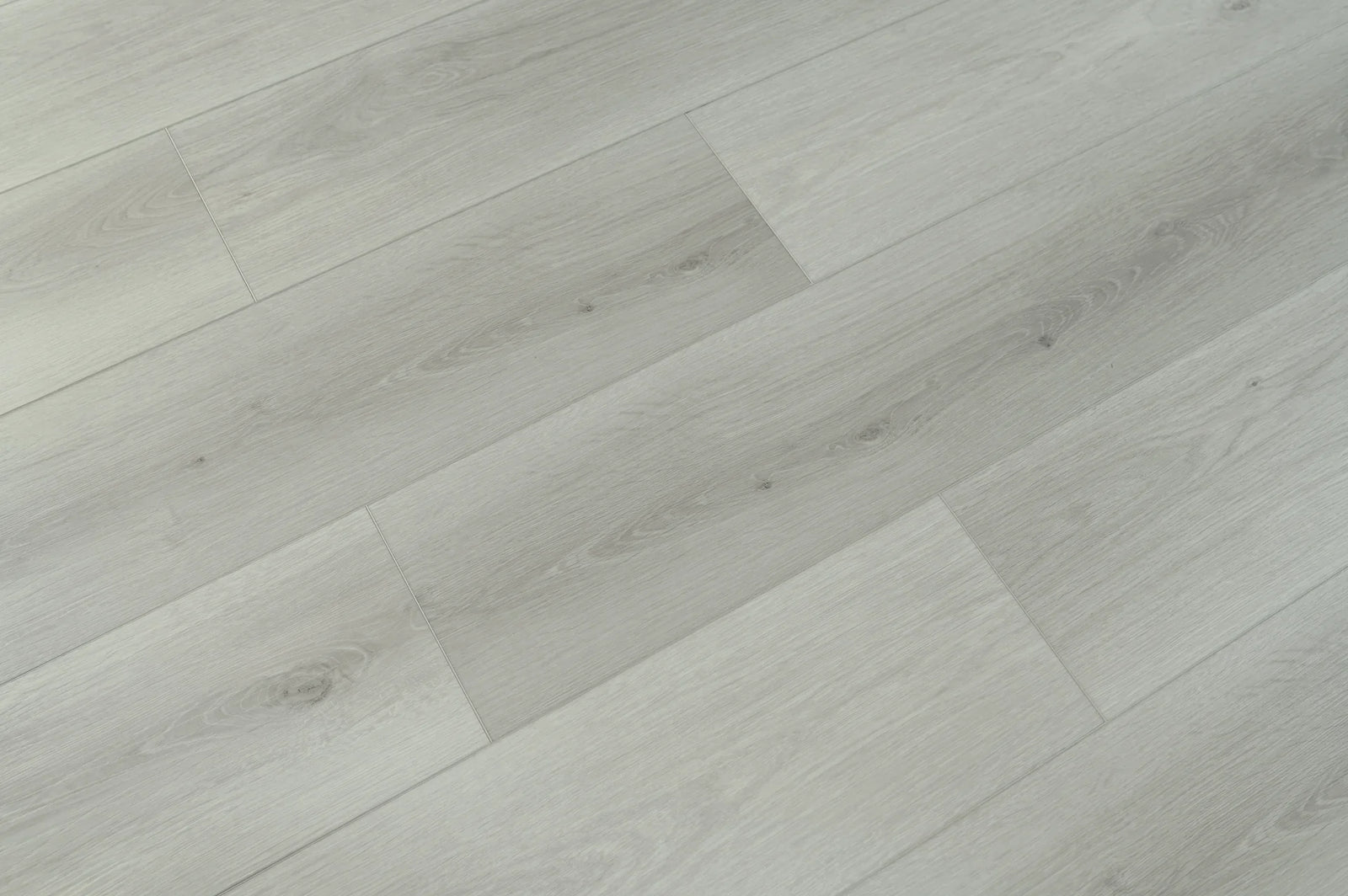 Close-up of gray wooden flooring with a herringbone pattern