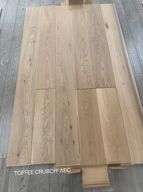 Planks of Toffee Crunch ABC Grade VIDAR premium European Oak engineered hardwood flooring.