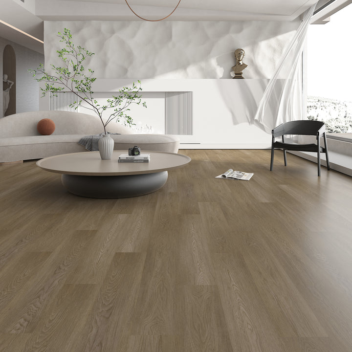 Modern living room with wooden flooring, white walls, and minimal decor.